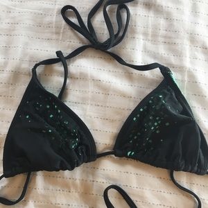 Black swim top with turquoise cut outs